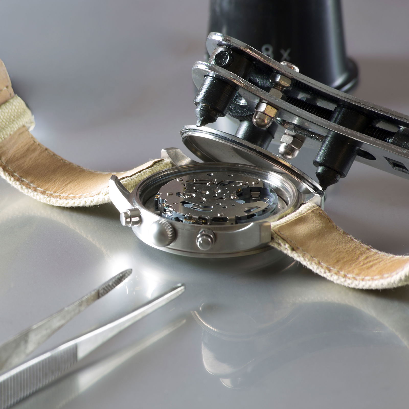 high-angle-view-wristwatch-with-equipment-table