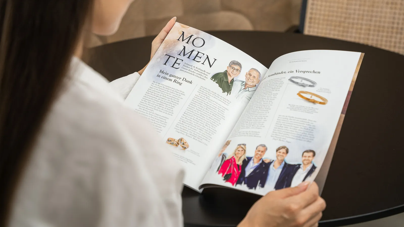 A woman looks at an open double page in the Wellendorff Family Magazine 2025 entitled ‘MOMENTS’