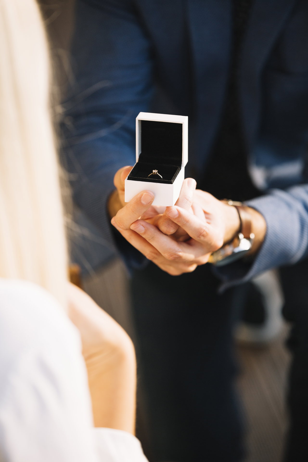 male-hands-with-red-velvet-box-containing-engagement-ring