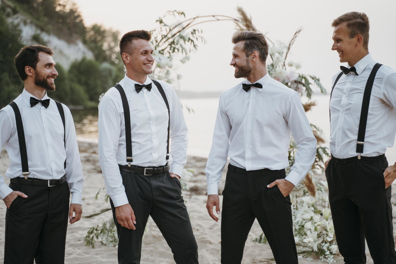 groom-best-men-posing-beach